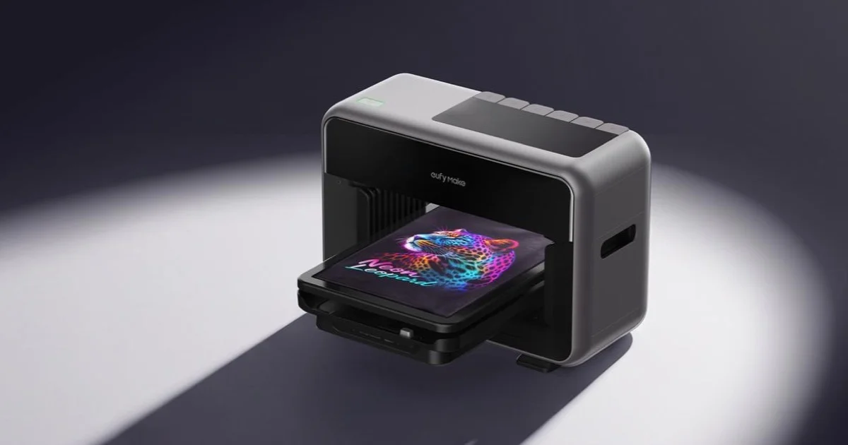 Anker eufyMake personal fabric printer prototype printing a colorful leopard graphic on a black shirt