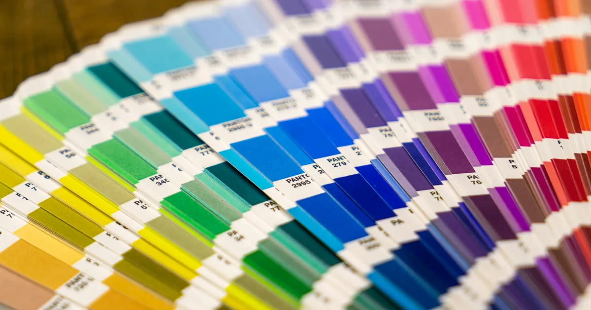 Close-up of a screen-printed graphic on apparel showing layered color application