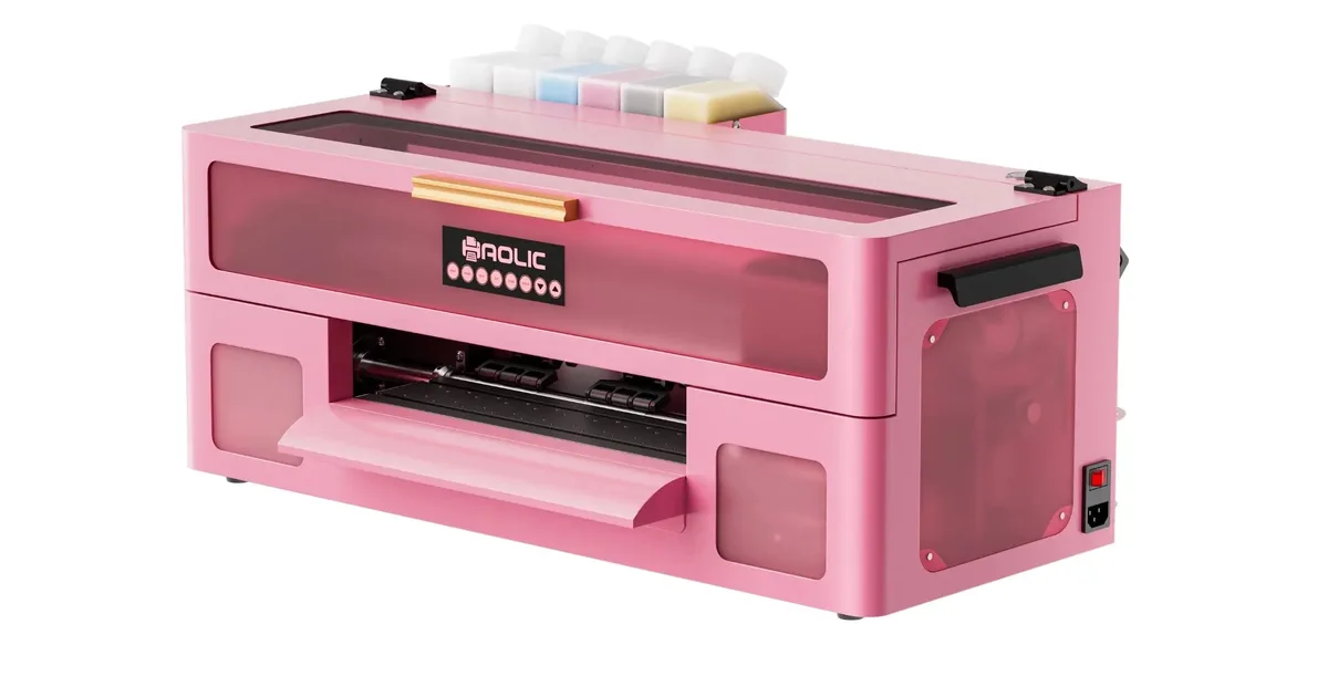 Pink Haolic XP-2 desktop DTF printer with ink tanks on top and the film output tray open