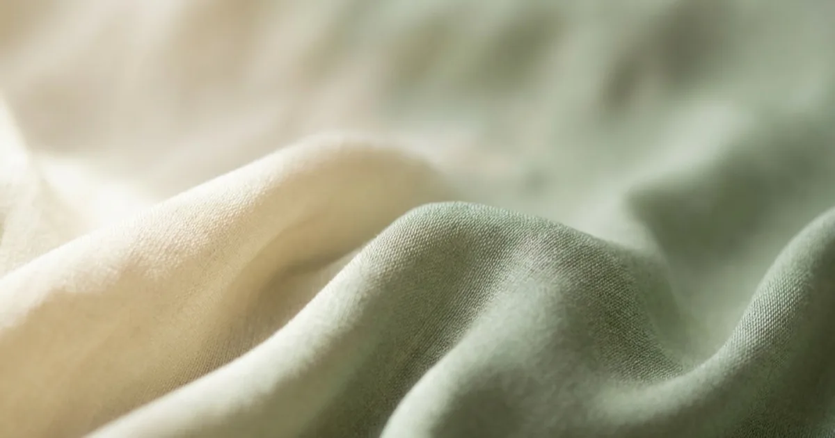 Close-up of draped viscose rayon fabric showing its fluid drape and subtle sheen